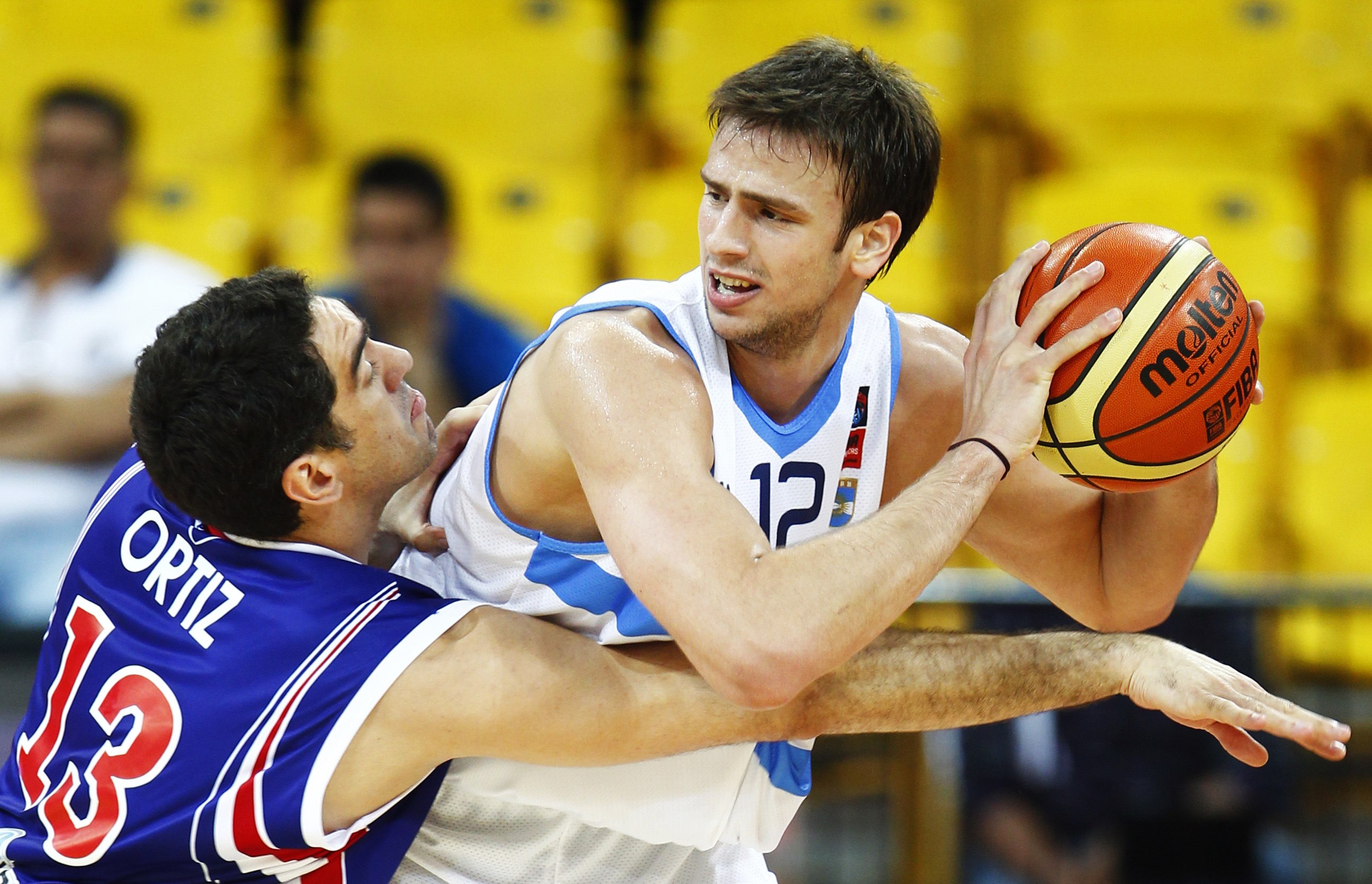 Argentina's Delia goes for a basket against Paraguay's Ortiz at the FIBA Americas Championship basketball game in Caracas