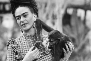 1944, Mexico City, Mexico --- 1944:  Photograph of Frida Kahlo (1910-1954), Mexican painter, holding a monkey.  She is the wife of Diego Rivera. --- Image by © Bettmann/CORBIS