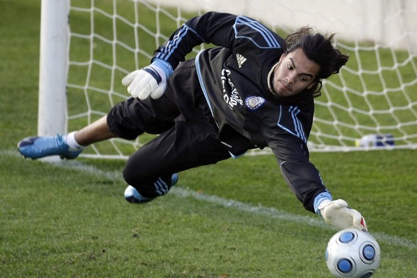 Argentina's goalkeeper Sergio Romero stops a ball during a training session in Madrid
